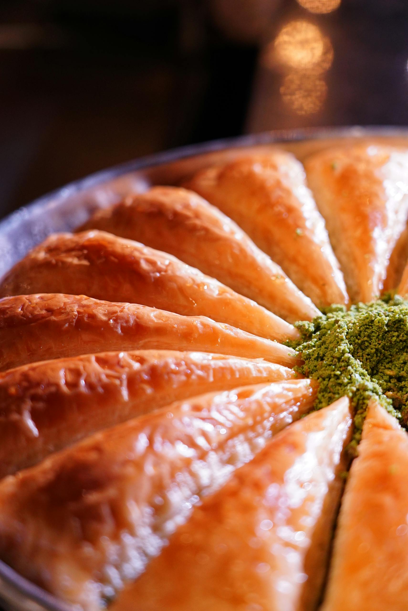 Delicious Turkish baklava with a pistachio topping, perfectly sliced for serving.